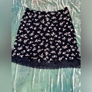 High waisted flower lace accent skirt. goes above the knee.